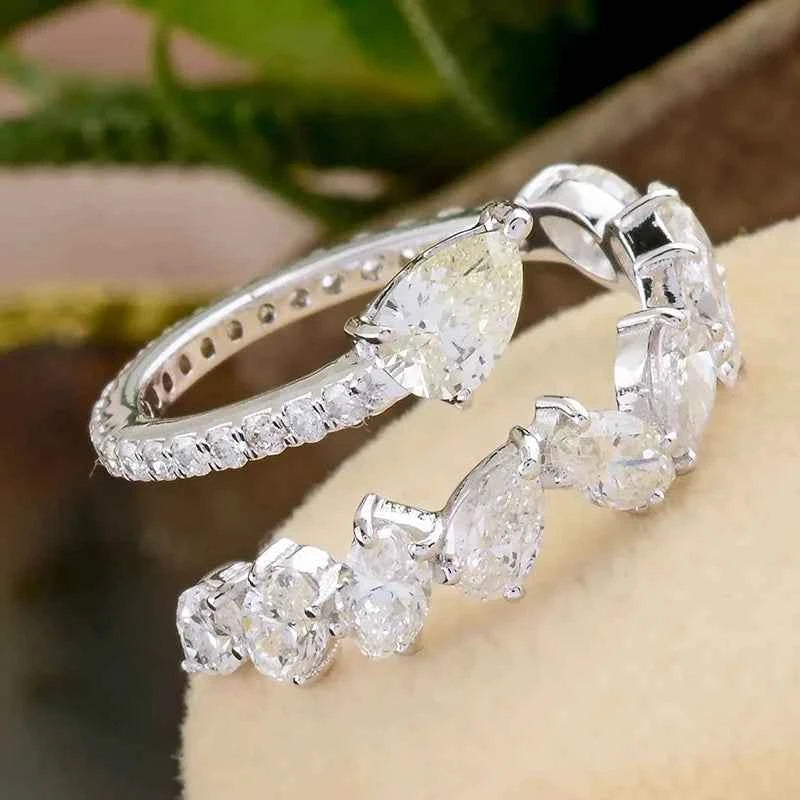 Pear cut diamond ring - natural G color diamond set in polished white gold band