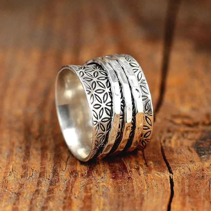 Silver flower pattern ring - bohemian stacked band with floral engraving on textured surface