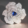 Sapphire flower brooch - 925 silver with pave setting and blue sapphire center