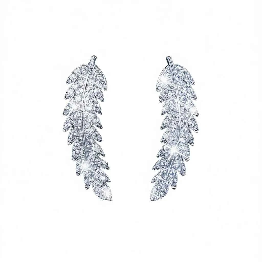 Feather stud earrings - white gold with crystal rhinestone bezel setting on women's ear