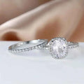 Cushion cut engagement ring - white gold halo setting with natural diamond center in classic style