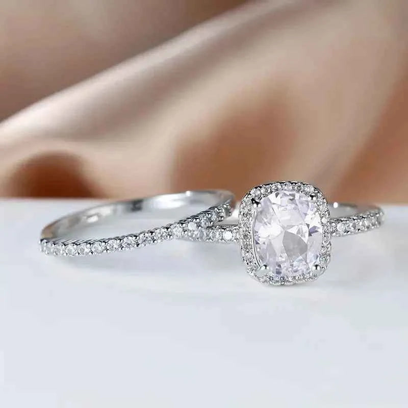 Cushion cut engagement ring - white gold halo setting with natural diamond center in classic style