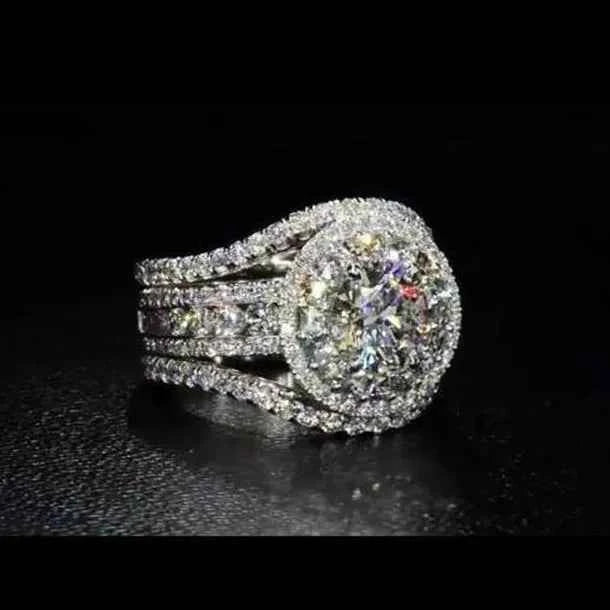 Round diamond engagement ring - elegant halo setting with side stones on white band