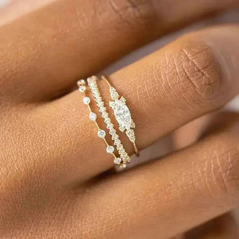 Marquise cut engagement ring - 18K solid gold with natural G-color diamond and side diamonds on white background
