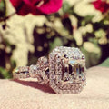 Emerald cut diamond ring - double halo pavé setting on elegant band