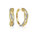 Two-tone diamond hoop earrings - gold and silver rope design with sparkling diamond inlay on women model