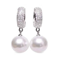 White gold pearl earrings - lustrous pearls with round brilliant diamond accents on 14k white gold huggie hoops