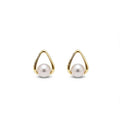 Bezel set pearl earrings - round white Akoya pearls in geometric gold bezel on display