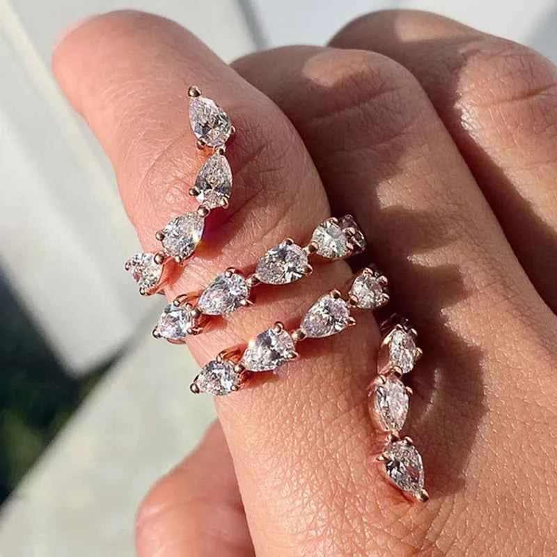 Pear cubic zirconia eternity band - rose gold prong setting ring on finger