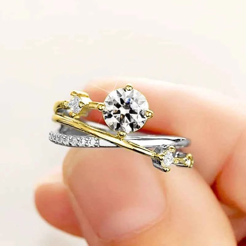 White gold engagement ring - round brilliant cut natural diamond with side diamonds on white background
