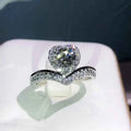 Heart cut engagement ring - natural D color diamond in white gold with halo setting and pave band