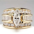 Marquise diamond engagement ring - 18K solid gold with round brilliant side stones on white background