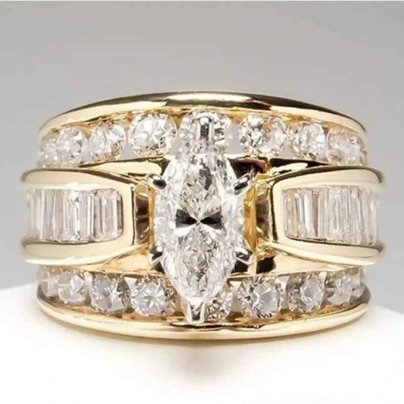Marquise diamond engagement ring - 18K solid gold with round brilliant side stones on white background