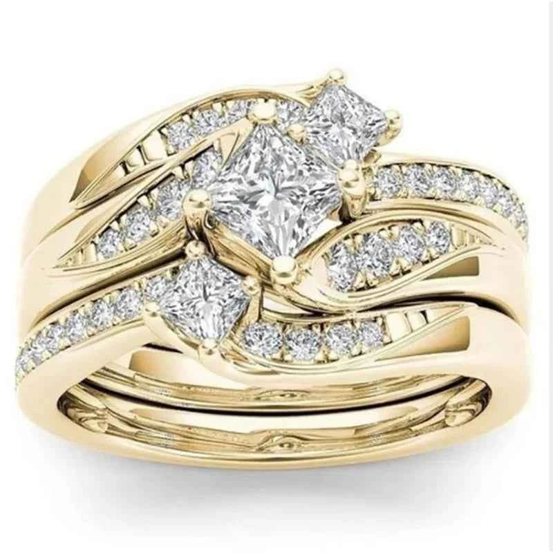 Bridal jewelry set - 18K gold princess cut diamond engagement ring with wedding band on white background