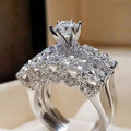 White gold diamond ring - round brilliant cut natural G color diamond in halo setting on floral pave band