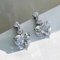 Gold heart drop earrings – heart-shaped crystal in claw setting on yellow gold plated silver