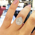 Pear cut engagement ring - natural diamond halo set in classic gold band