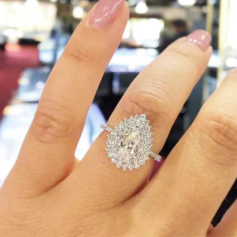 Pear cut engagement ring - natural diamond halo set in classic gold band
