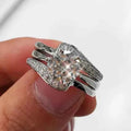Split band diamond ring - round cut center stone with pave band on polished silver metal
