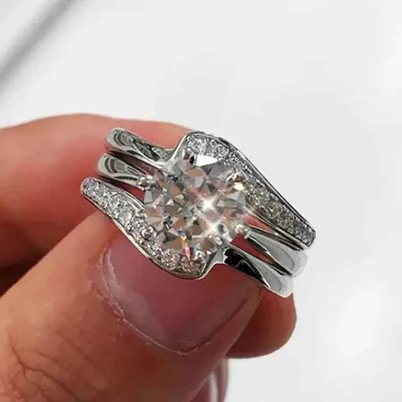 Split band diamond ring - round cut center stone with pave band on polished silver metal