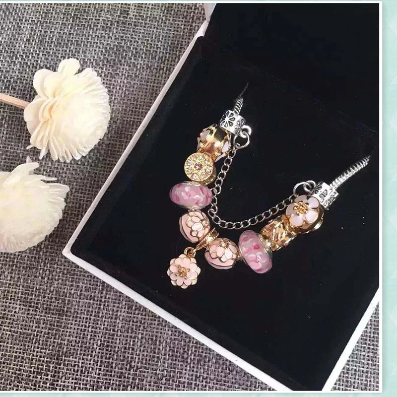 Elegant Crystal Flower Charm Bracelet - Gold Bead Design