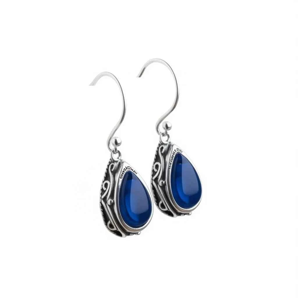 Blue gemstone drop earrings - gold plated teardrop with bezel setting on white background