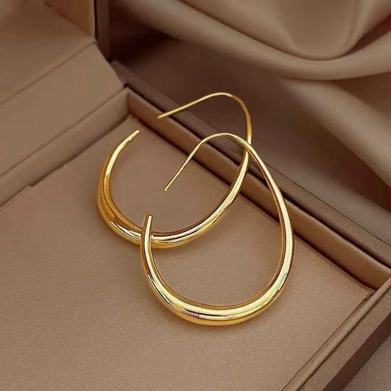 Elegant Sterling Silver Golden Ellipse Hoop Earrings
