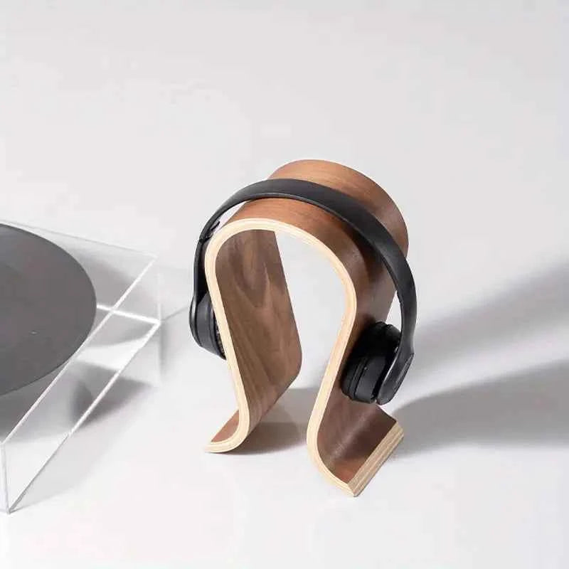 Wooden headphone stand - U-shaped walnut wood desktop display on a clean desk