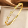Luxury Cross Charm Bracelet - Gold-colored bangle with pave-set zircon cross charm
