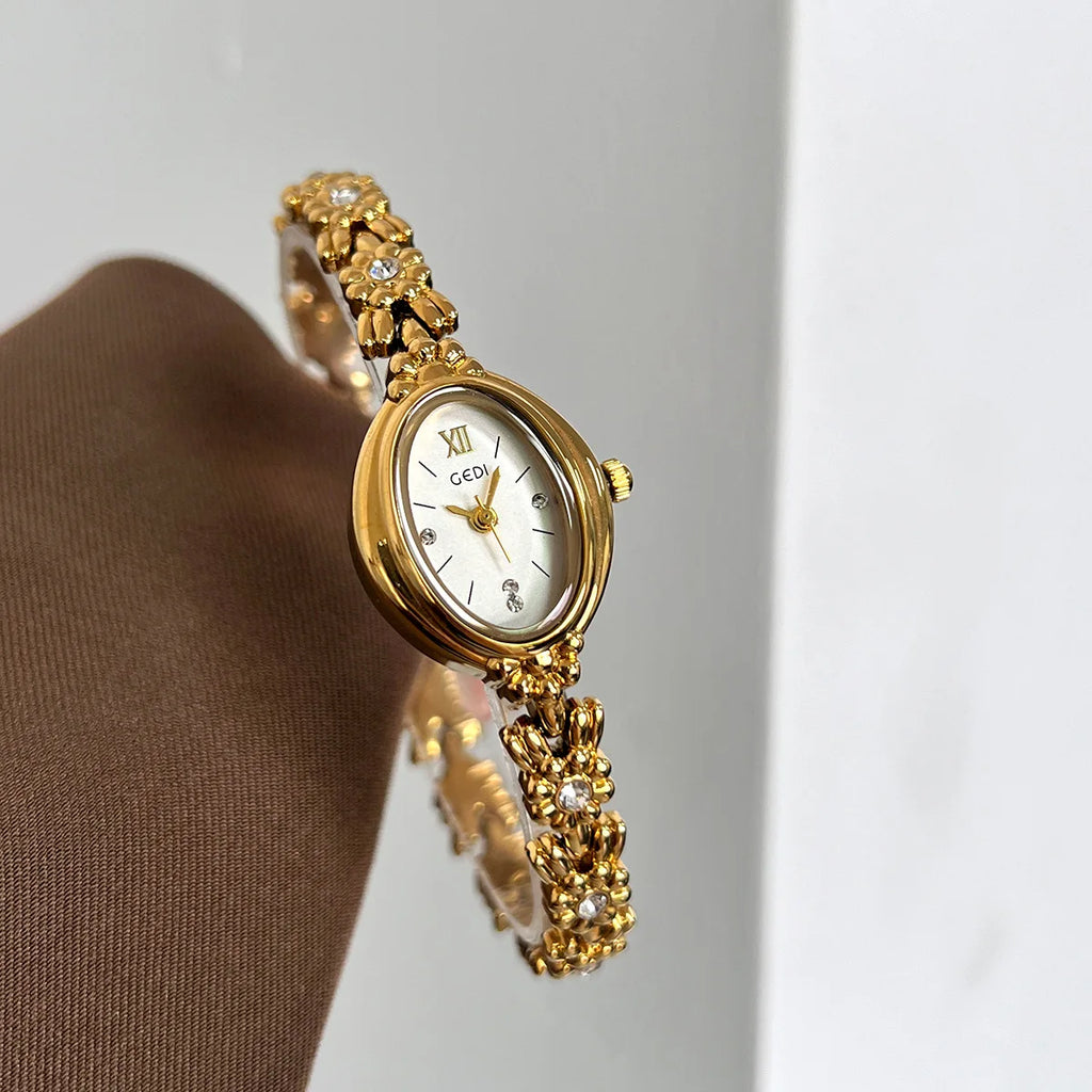 Retro diamond women's watch - gold-tone with diamond-encrusted oval case and matching bracelet