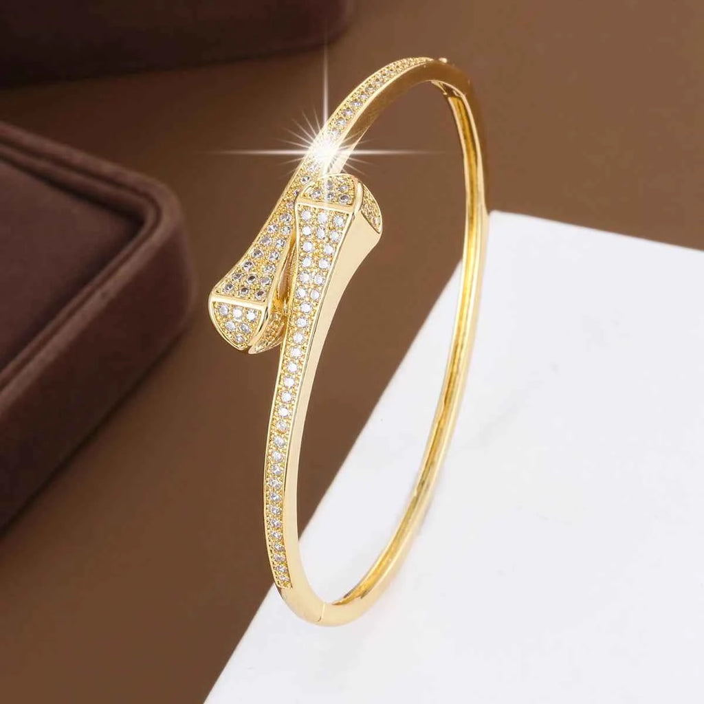 Geometric Zirconia Bangle - Elegant golden white geometric bracelet with channel-set cubic zirconia stones