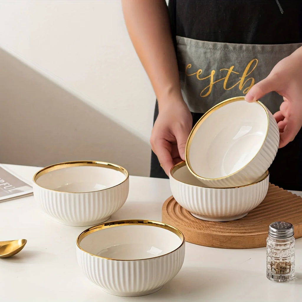 Gold Ceramic Dinnerware Set - Elegant gold-trimmed ceramic plates and bowls