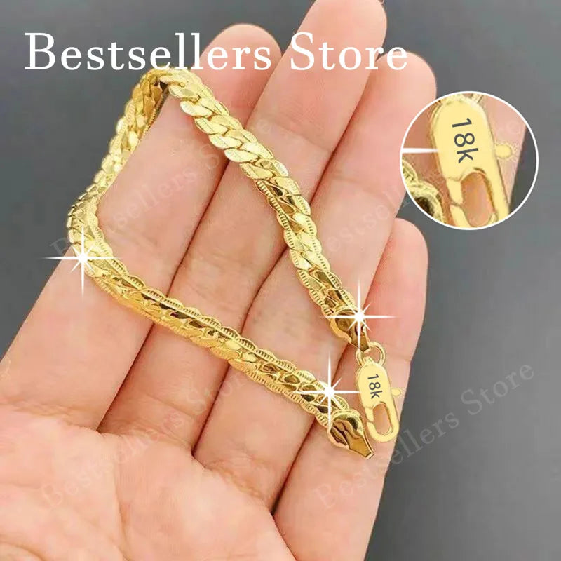 Sterling Silver Embossed Bracelet - 18K gold plated 5mm embossed bracelet on a model's wrist