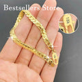 Sterling Silver Embossed Bracelet - 18K gold plated 5mm embossed bracelet on a model's wrist