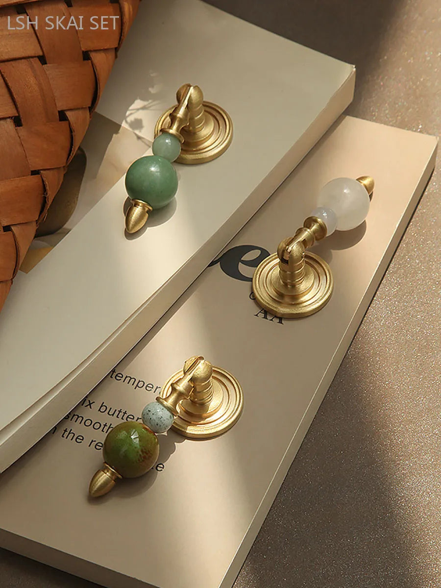 Brass cabinet handles - elegant crystal knob on a brass base for kitchen or dressing table furniture
