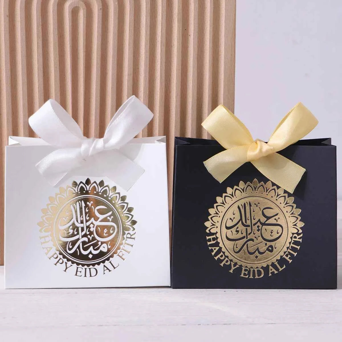 Elegant Eid Gift Boxes - 5 compact gift boxes in black, green, and white with Arabic script and golden circles