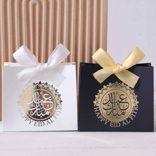 Elegant Eid Gift Boxes - 5 compact gift boxes in black, green, and white with Arabic script and golden circles