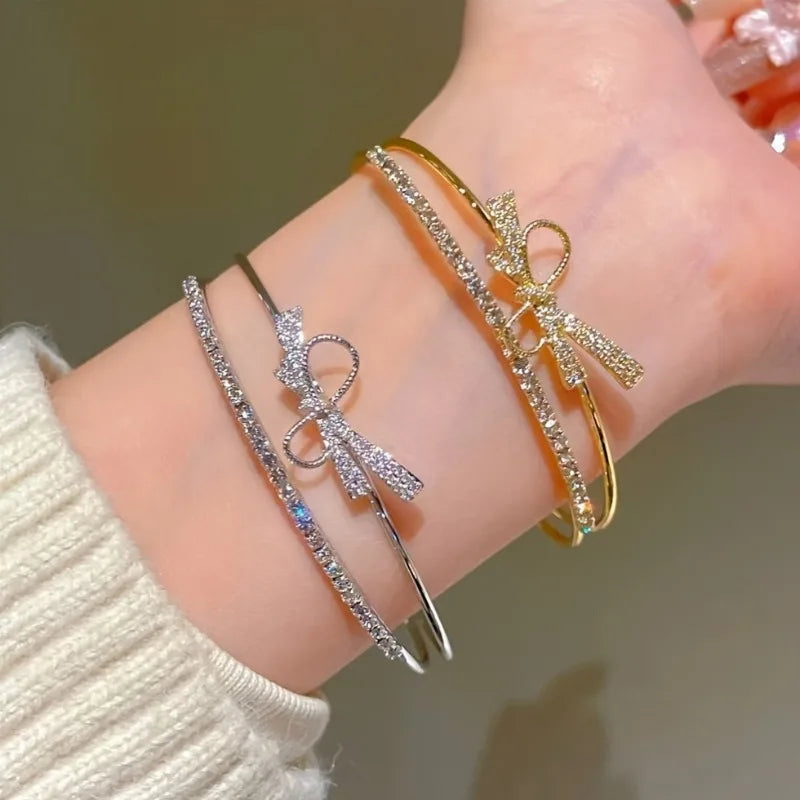 Elegant Bow Bracelet - Sparkling platinum-plated cuff bracelet with a delicate bow design