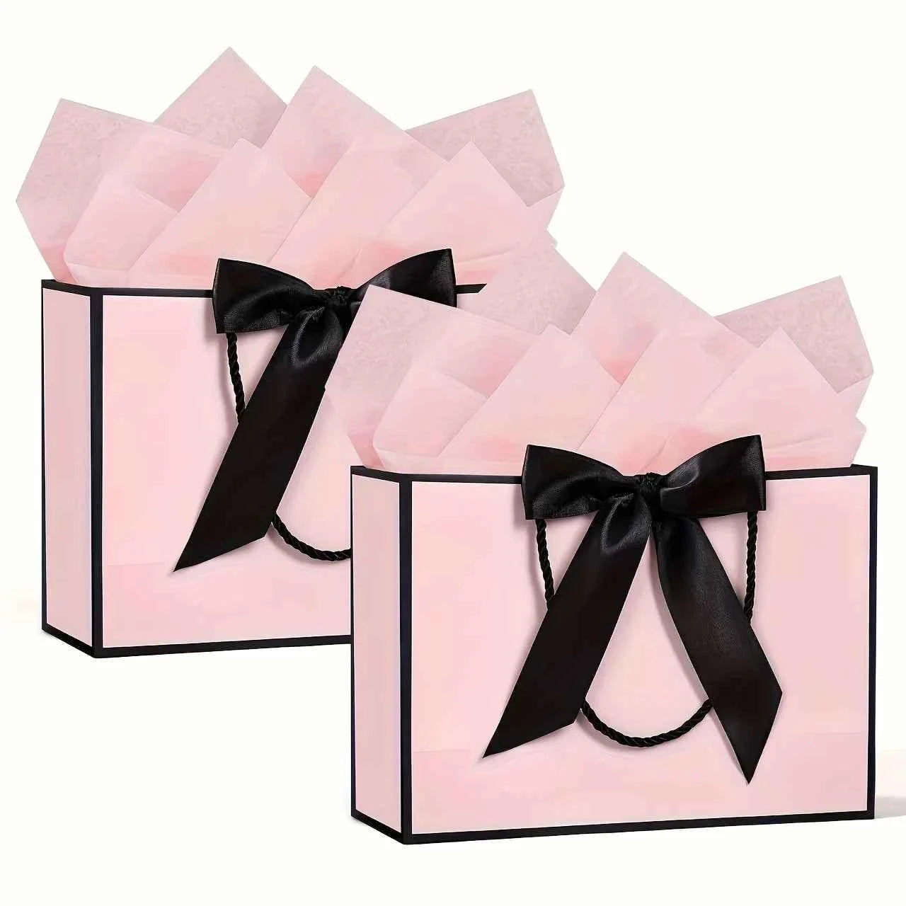 Elegant gift bags - pink hand-held shopping bags with bow ribbons, greeting cards, and thin paper