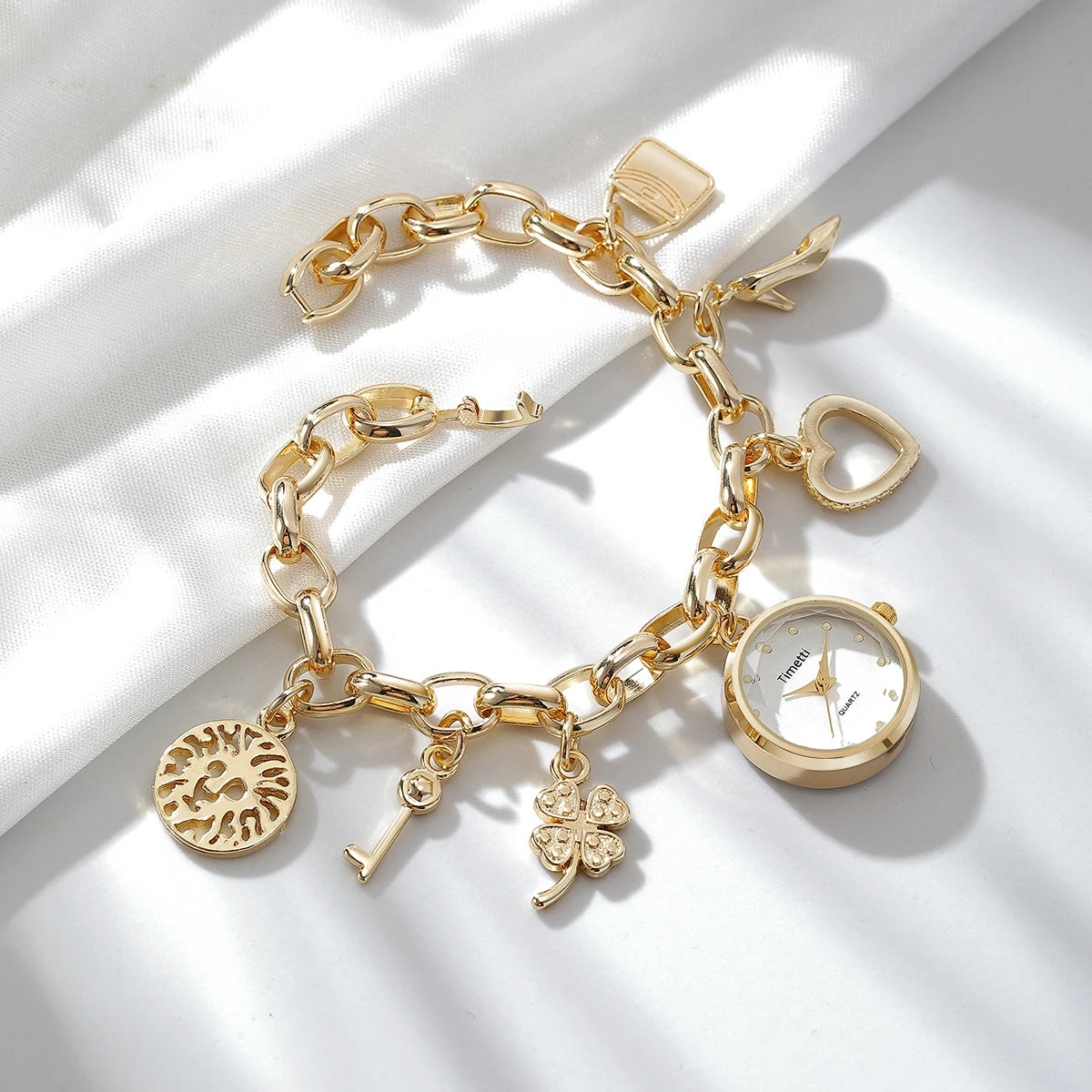 Casual luxury bracelet watch - elegant gold alloy band with numberless white dial