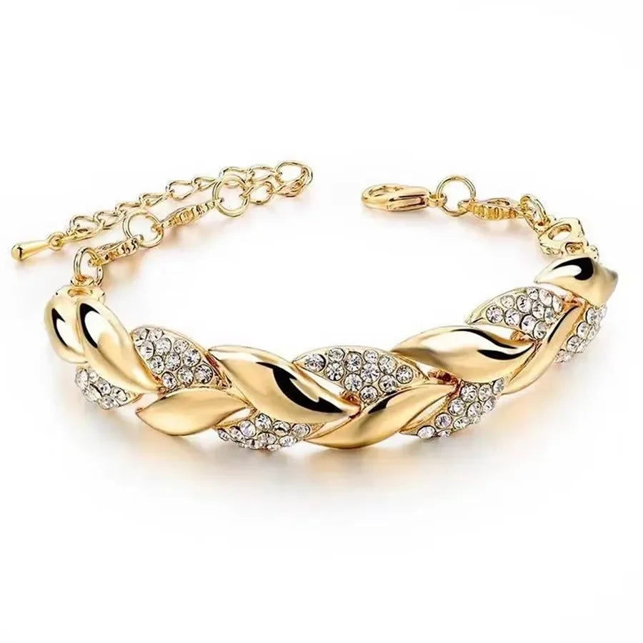 Braided leaf bracelet - elegant design with shimmering crystal charm in golden finish