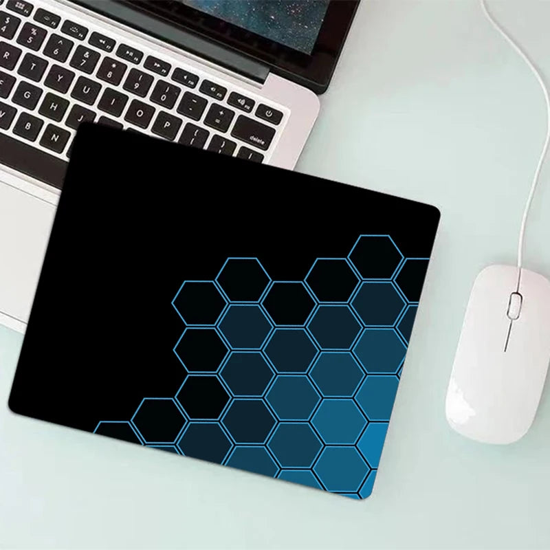 Gaming Mouse Pad - black hexagonal honeycomb design on a desk