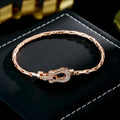 Rose gold horseshoe bracelet - elegant chain and link design in a lustrous rose gold finish
